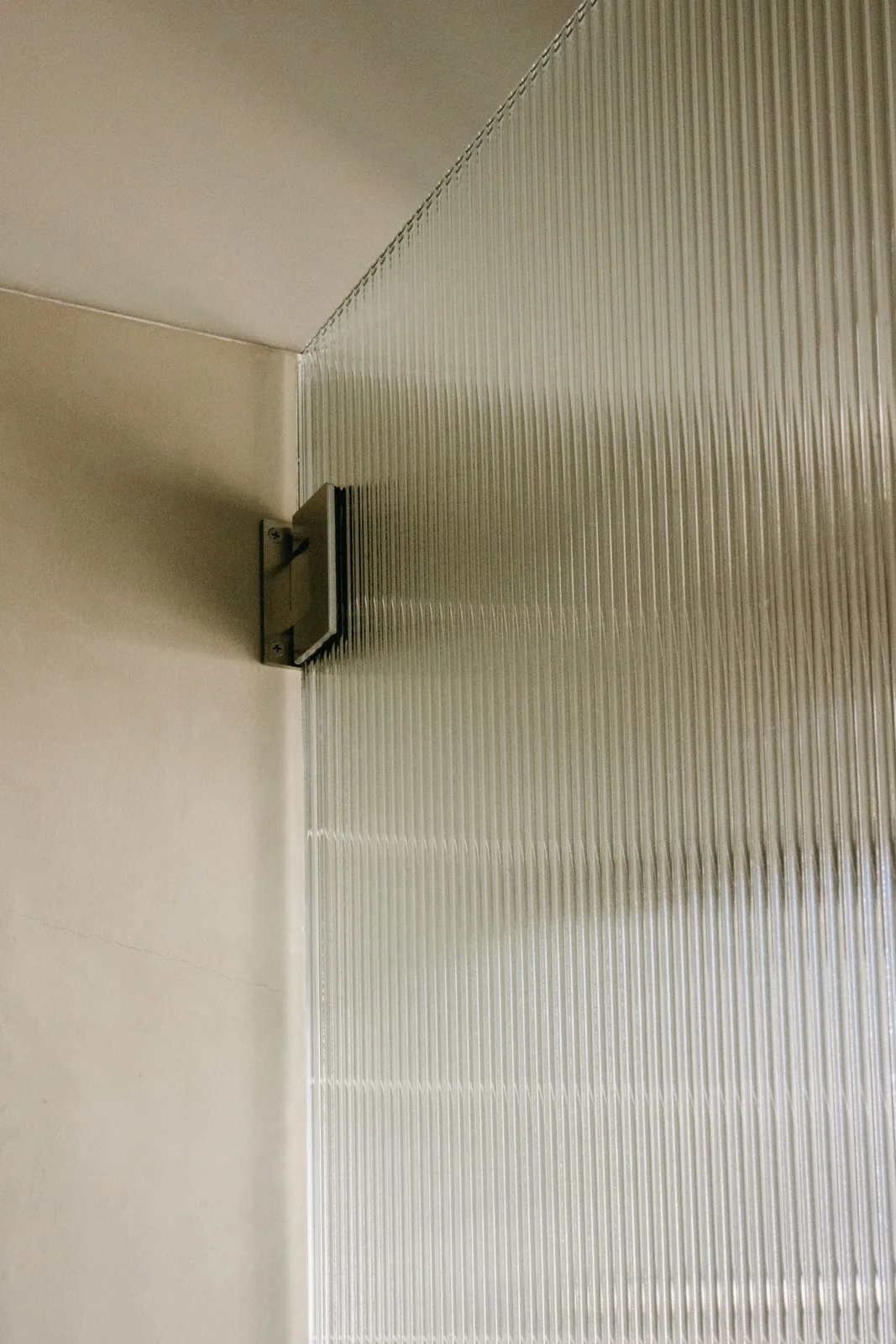 Fluted glass shower screen detail