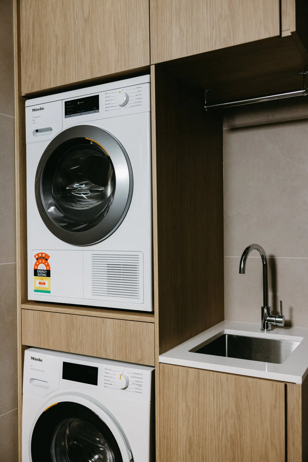 Stacked washer and dryer in timber joinery