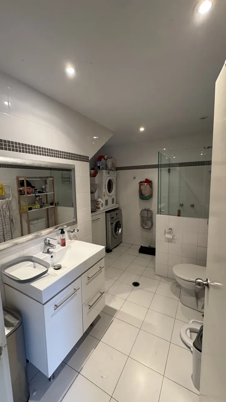Second bathroom and laundry before, wider view