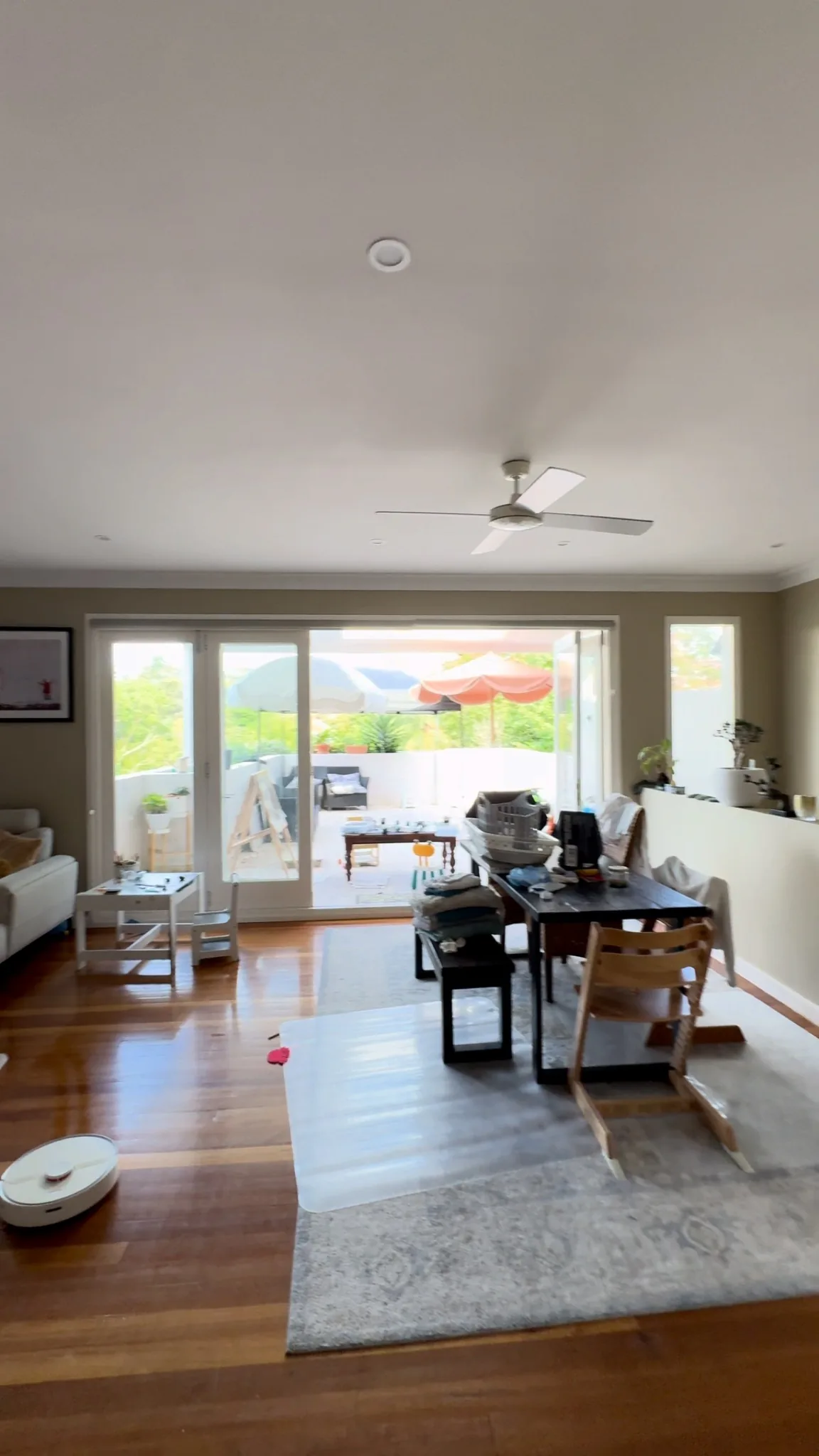Living room before renovation with the old doors and floor finish